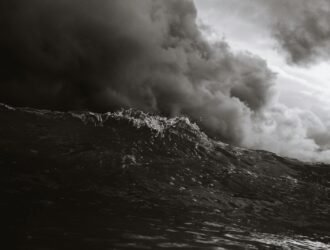 grayscale photo of body of waves